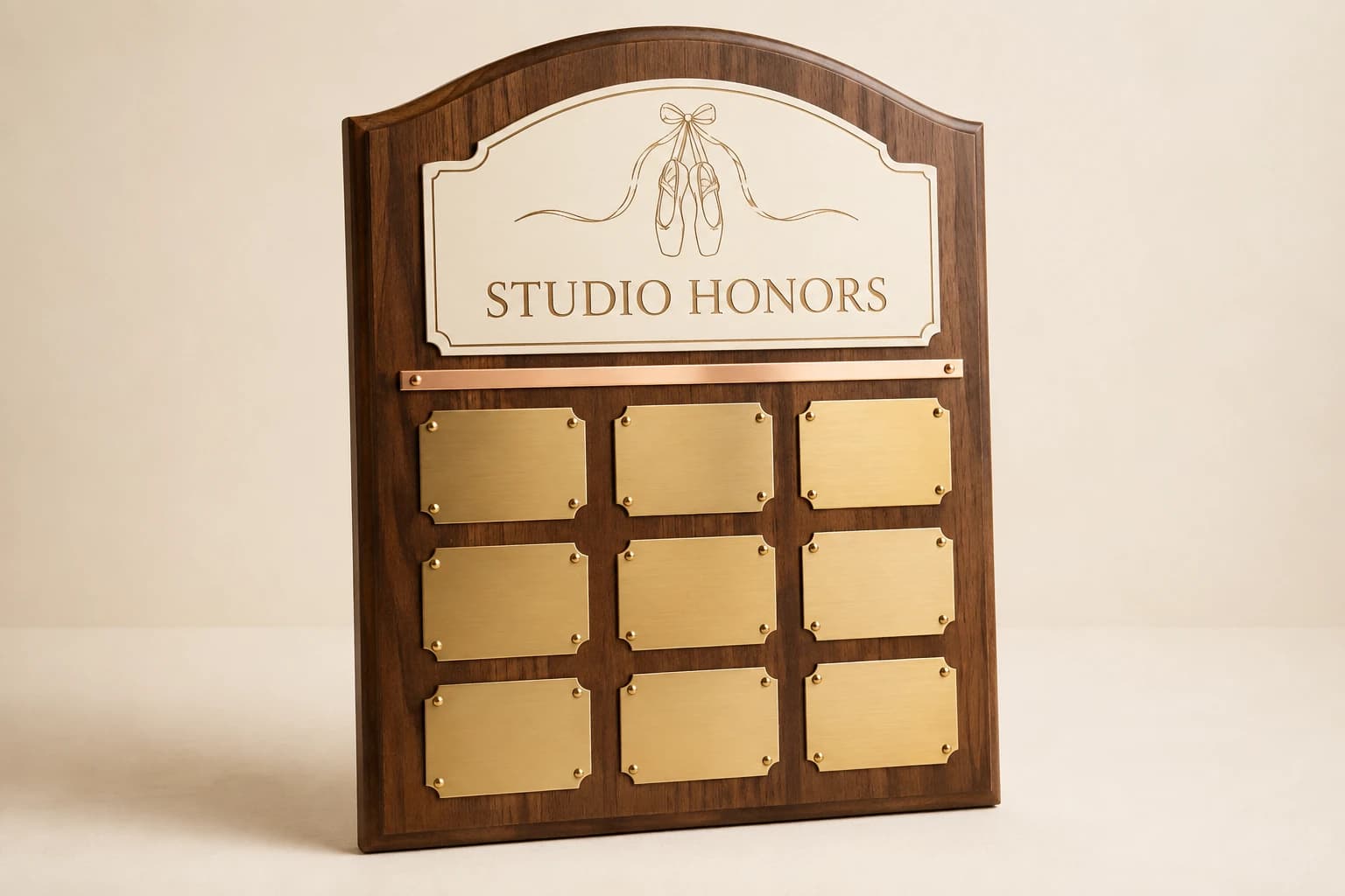 Arched walnut dance honors board with nine brass recipient plates.
